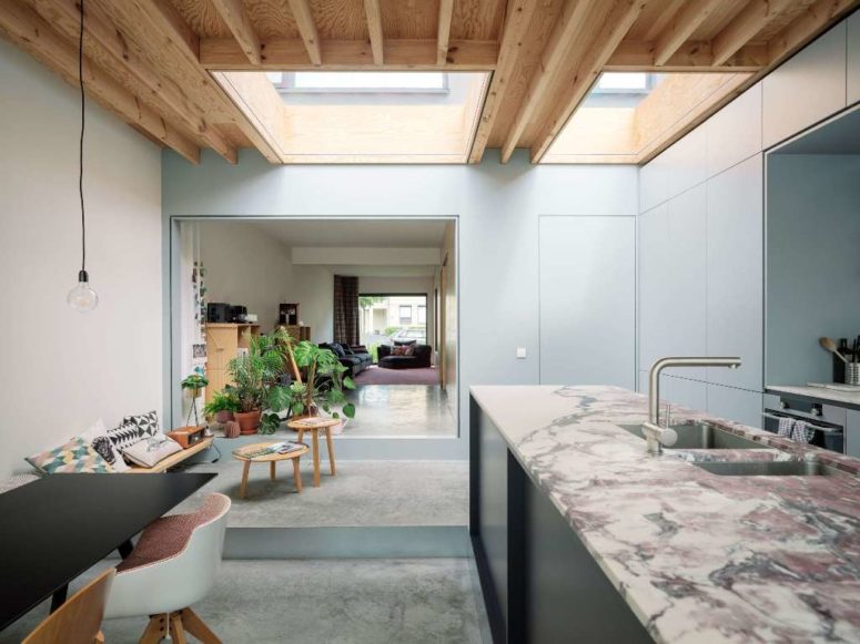The sitting nook by the window is veyr comfy and cozy, there are open storage units and much potted greenery The sitting nook by the window is veyr comfy and cozy, there are open storage units and much potted greenery