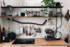 05 thin dark shelves of reclaimed wood is a nice natural touch to your kitchen and a branch adds even more