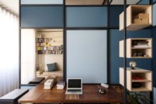 a small home office with a partition wall that separates it