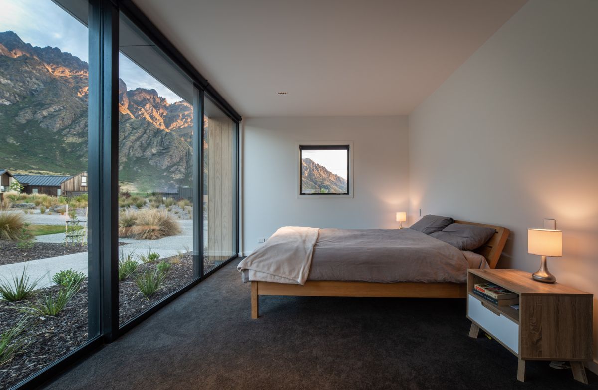 The bedrooms are small and opened to outdoors, there are glazed walls to enjoy the landscape