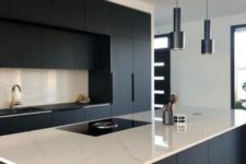 11 a stylish minimalist black and white kitchen with a white marble kitchen island countertop and a backsplash – just a bit of refreshing touches