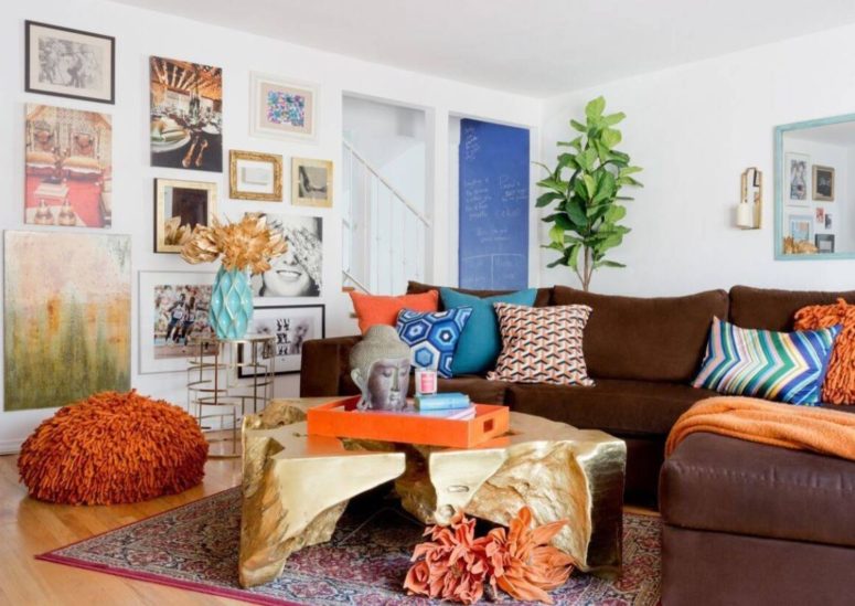 a colorful living room done with loads of cobalt blue, turquoise, rust and deep red looks bright and fun