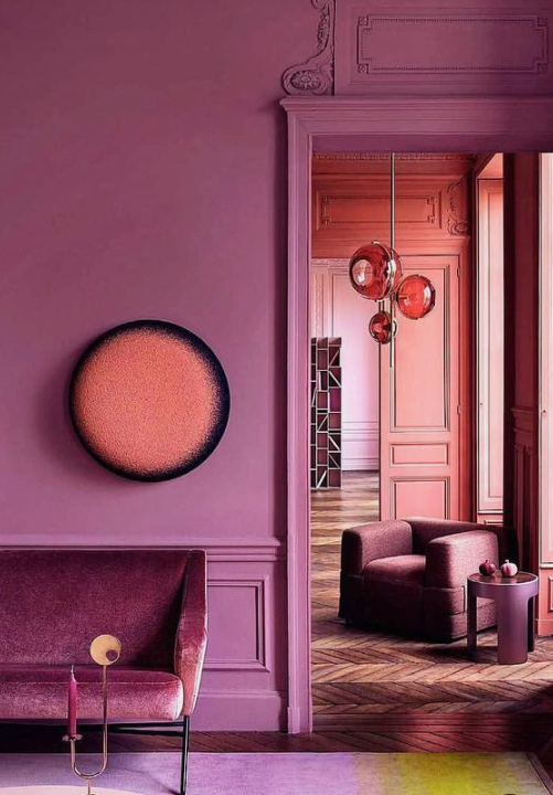 a bold space done in fuchsia and mauve is a very refined space flooded with warm and refined colors
