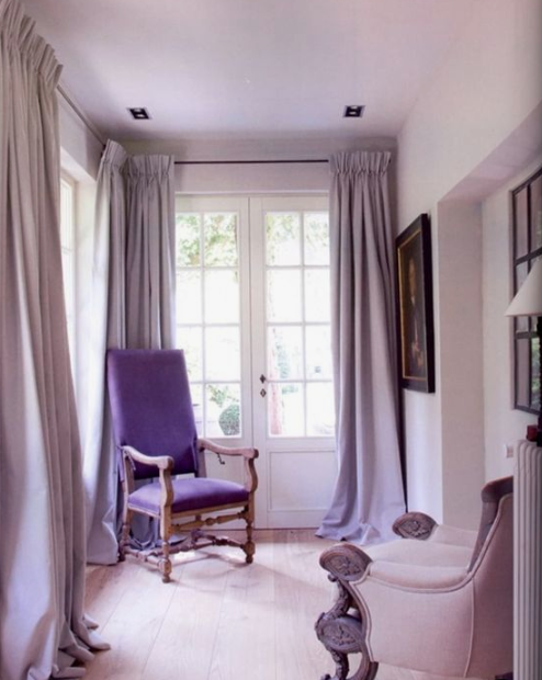 a sophisticated lilac space with a purple chair and elegant artworks will make any room refined and gorgeous