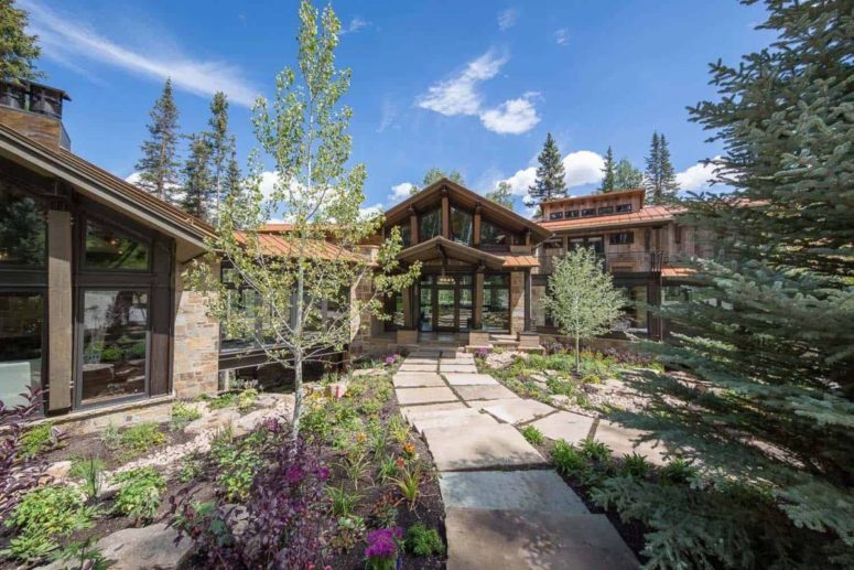 This rustic mountain home features gorgeous views, and its whole design was inspired by them