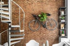 02 an exposed brick wall with a bike shelf on it is a great industrial touch to this contemporary space