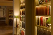 02 make your bookshelves stand out a lot with built-in lights like these ones and your space will also seem larger thanks to it