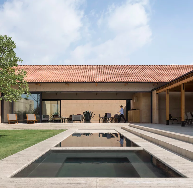 an outdoor area with a tub and a pool The house is fully opened to outdoors, there's a pool and a tub, an outdoor dining space and a deck for relaxing
