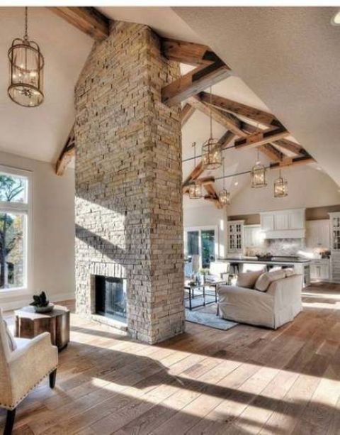 a grey brick double-sided fireplace will give a cozy rustic feel to the space and will make it welcoming and warming up