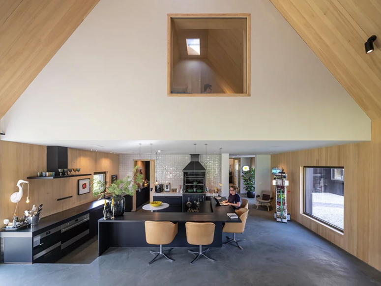 The kitchen and dining spaces are united and there's a platform to divide them a little bit