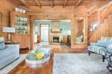 04 There’s a vintage corner cabinet and a large mirror in a chic frame