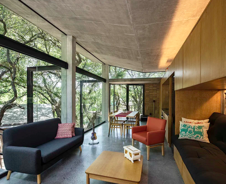 This is a social pavilion with a living, dining and kitchen rooms, all of them are united into one space This is a social pavilion with a living, dining and kitchen rooms, all of them are united into one space