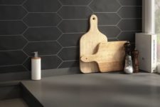 04 a black honeycomb tile backsplash with white grout is a creative idea that fits minimalist spaces