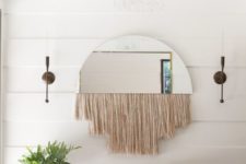 04 a half circle mirror with long blush fringe is a cool idea for a boho entryway like this one