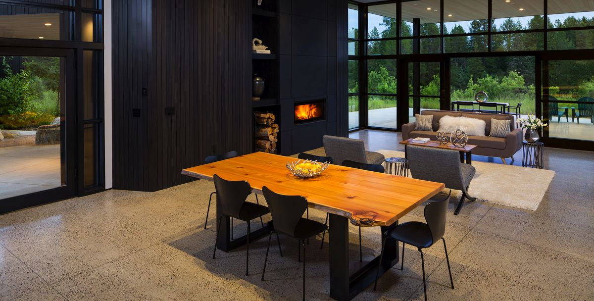 The dining space is right here, with a live edge table and black chairs