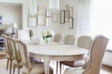 05 a chic and elegant neutral dining room with upholstered furniture, cool glass pendant lamps and a vintage table