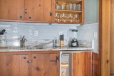 06 The contrast between the rich stained cabinets and grey and light blue is a stylish and refined idea