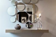 06 an arrangement of round mirrors of various sizes and a floating vanity for an ethereal look