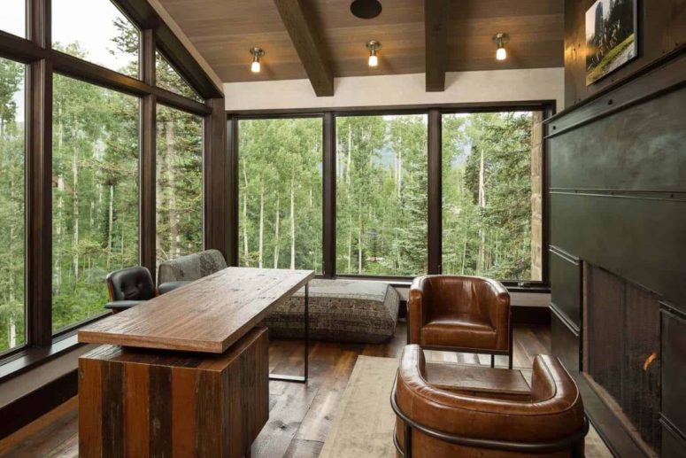 Wood, leather and darkened metal make the spaces feel all-natural and cool