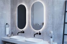 08 a minimalist bathroom highlighted with backlighting behind the mirrors looks bolder and brighter