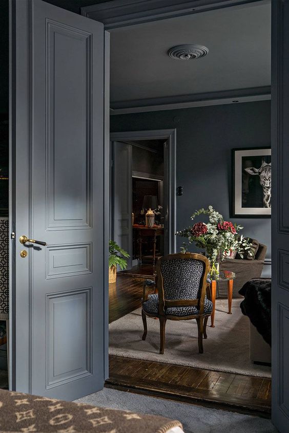 an elegant home done in graphite grey, with matte surfaces and some colorful touches but not too many