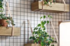 08 hanging shelves of wood and leather like these ones can become your own rustic wall garden