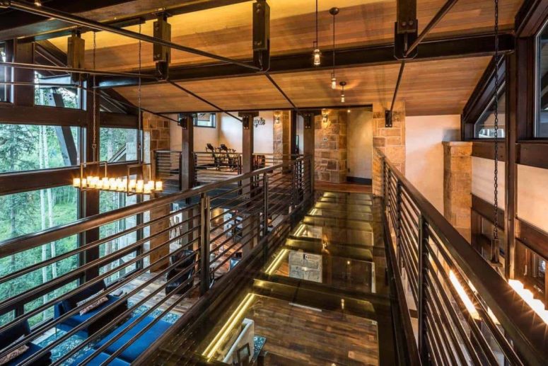 The house has three main sections which are connected by glass walkways such as this one