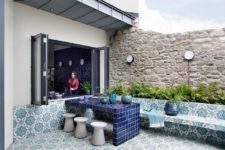 11 The terrace is done in Moroccan boho style, with printed tiles and lots of greenery