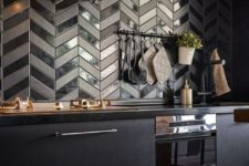 11 a very eye-catchy herringbone tile backsplash in matte and shiny finishes is very bold