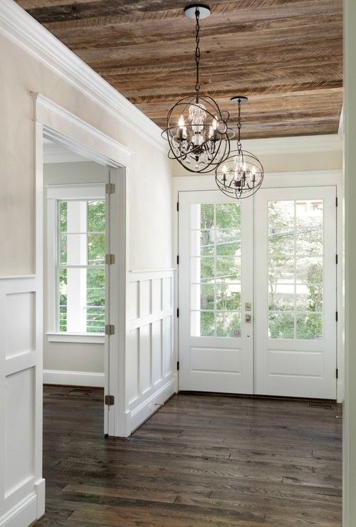 a reclaimed wooden ceiling echoes the floor and makes the space feel industrial and rustic at the same time