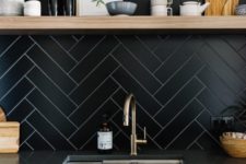 12 long and narrow tiles clad in a herringbone pattern with white grout that highlights them – a great contrasting idea