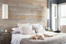 13 a reclaimed wooden wall and ceiling part make the bedroom feel cozier and a bit industrial
