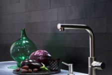 13 matte black tiles with mathcing grout look very unusual and textural adding interest to the space