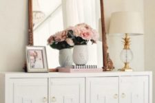 16 an IKEA Malm dresser turned into a chic vintage piece with overlays and brass knobs for a refined touch