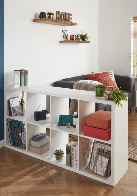 a simple open storage unit liek this one can be easily DIYed for separating your spaces