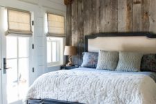 19 a relaimed wooden wall and matching wooden beams make the space very cozy and warm