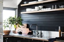 20 a black shiplap backsplash is a budget-friendly idea that matches the black plywood cabinets and a metal countertop