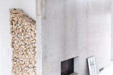20 a concrete fireplace with a large firewood storage space by the corner is a very chic idea to go for
