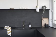 21 a matte black painted backsplash is a low cost idea and it continues the decor of the kitchen with black cabinets and countertops