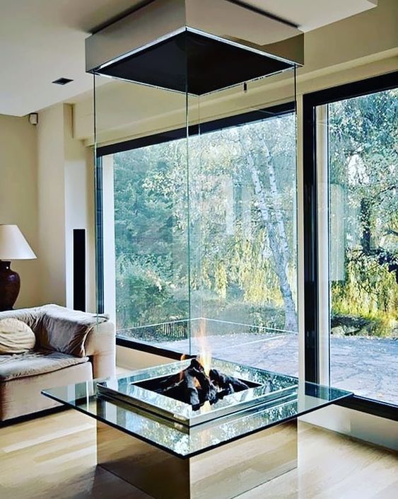 a spectacular glass encased fireplace is a statement piece in any living room