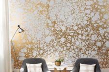 22 a printed gold and white wallpaper wall will make your living room very bold and stylish