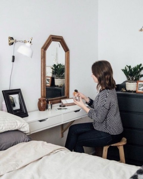 an IKEA Ekby Alex shelf used as a vanity or a nightstand for your small bedroom, it's very comfortable for holding stuff