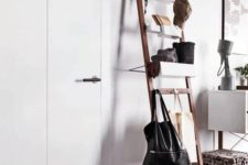 30 a modern ladder with bags on it and soem storage containers for small stuff is ideal for an entryway