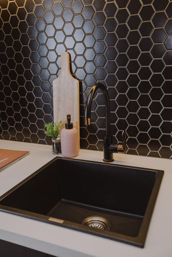 a beautiful and textural black hex tile backsplash will add chic and elegance to the kitchen, and a black sink and fixtures echo with it