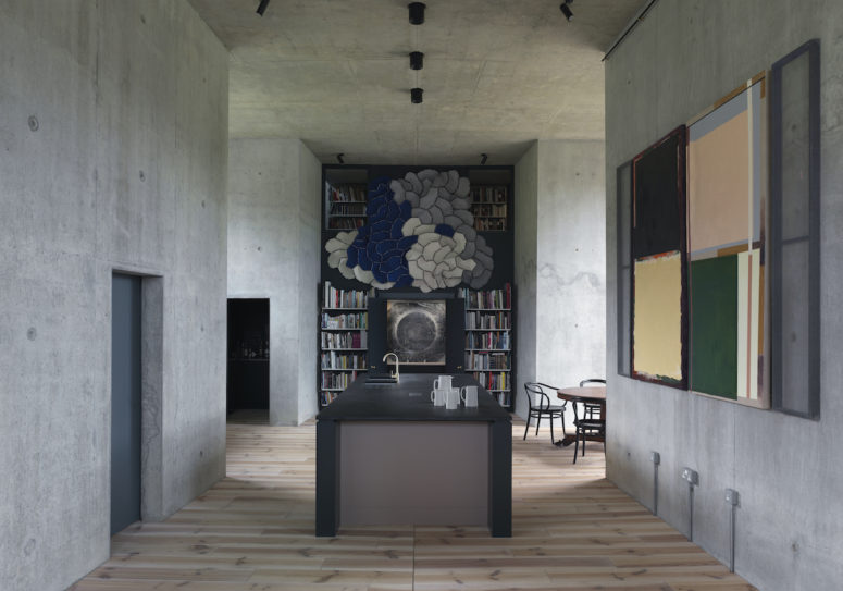 Minimalist Farmhouse In Raw Concrete With Bold Art
