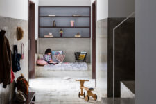02 This is a small kid’s nook done with built-in shelves, a concrete platform bed and two doors to outside