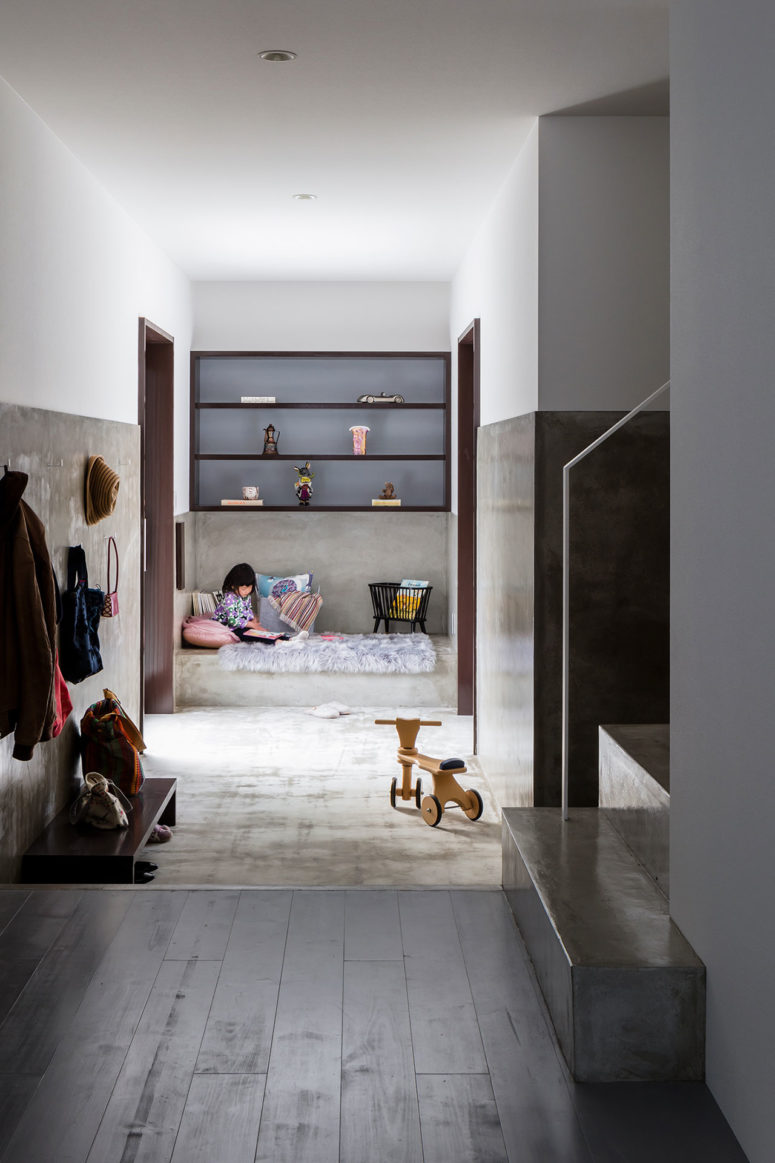 This is a small kid's nook done with built in shelves, a concrete platform bed and two doors to outside This is a small kid's nook done with built-in shelves, a concrete platform bed and two doors to outside