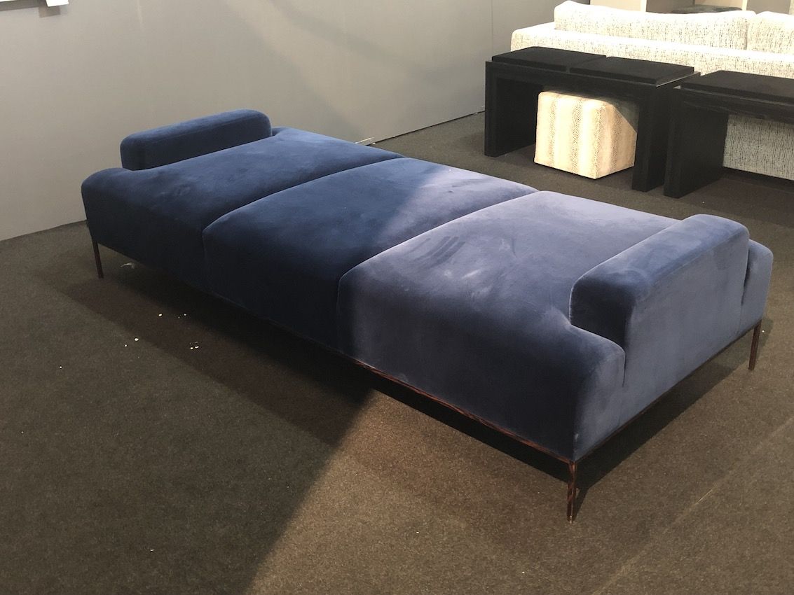 an upholstered classic blue daybed will add color and comfort to your space adding chic and an edgy touch