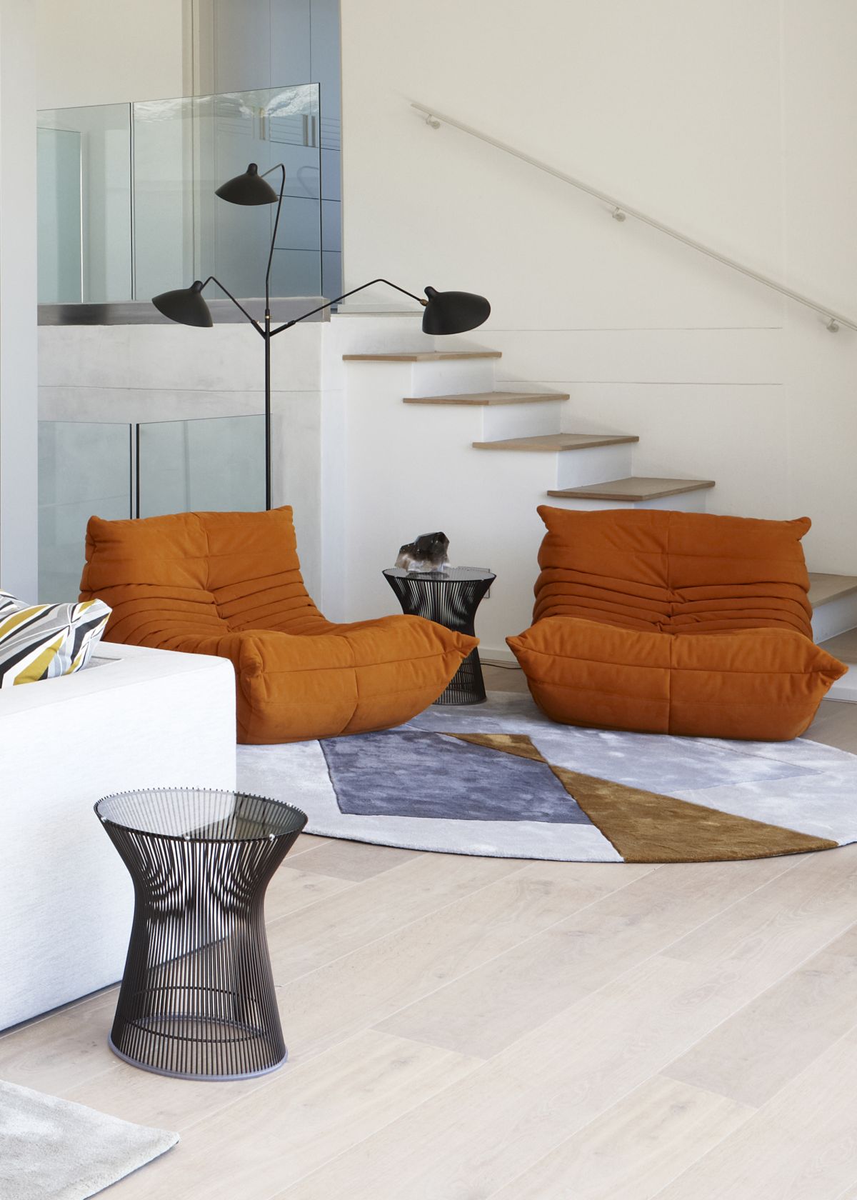 There are some bright and bold accents, and these orange chairs are among them