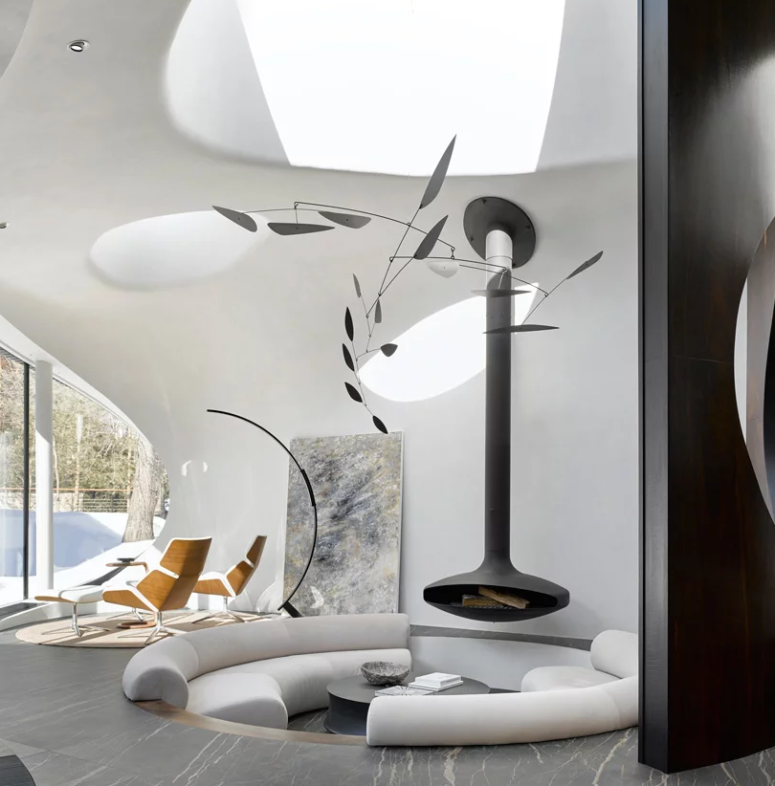 The living space also features a sitting zone by the glazed wall, some skylights and a statement artwork